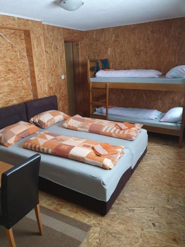 two beds in a room with two bunk beds at Morehead Guesthouse Vlasic in Vlasic