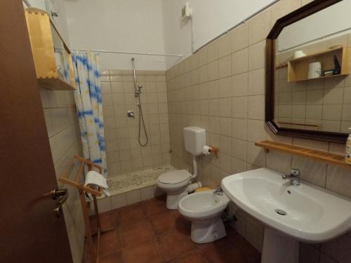 a bathroom with a sink and a toilet and a shower at Casale Galati in Sciacca