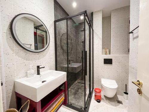 a bathroom with a sink and a shower at Colorful and Quiet Room with Balcony next to Hilton in Athens