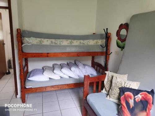 En eller flere senge i et værelse på Casa perto da praia, Maitinga