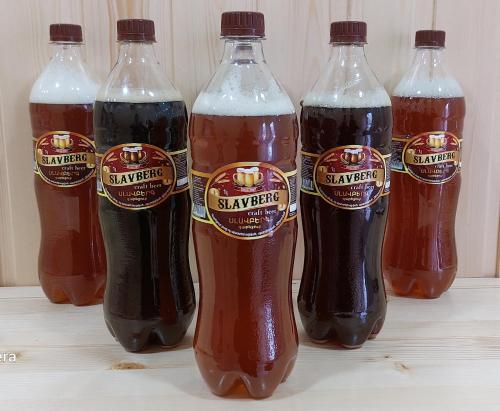 a group of bottles of soda sitting on a table at ARAGAST HOTEL & BREWERY пивоварня in Sevan