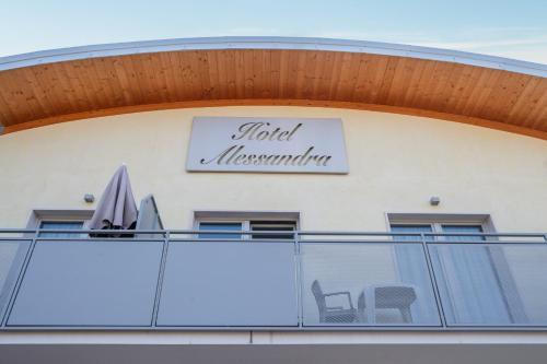 a hotel manson sign on the side of a building at Hotel Alessandra in Garda