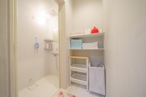 a bathroom with a shower and a towel rack at Osaka - House - Vacation STAY 8920 in Osaka