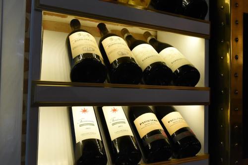 a bunch of wine bottles in a wine cellar at Hotel Hymeti's Palace in Pogradec