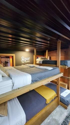 a room with three beds on a boat at Bucanaan hostel boutique in Córdoba