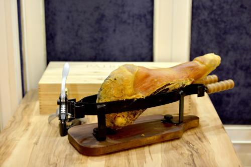 a chicken leg on a stand on a table at Hotel Hymeti's Palace in Pogradec