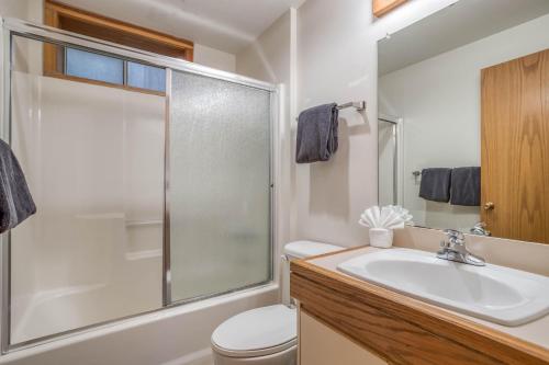 a bathroom with a shower and a sink and a toilet at Sea Star #1 (MCA 51 A-GF) in Manzanita