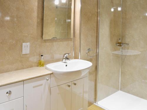 a bathroom with a sink and a shower at Bram Crag Barn in Legburthwaite