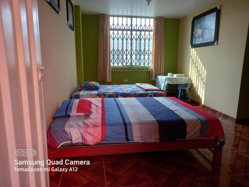 Кровать или кровати в номере Casa Hospedaje San Miguel
