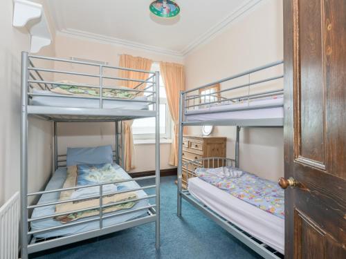 a bedroom with two bunk beds in a house at Hartrees House in Silecroft
