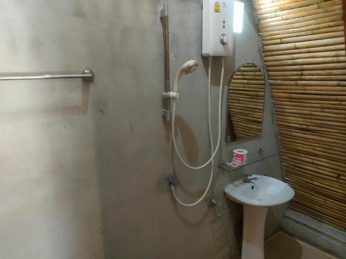 a bathroom with a shower and a sink at Baanmaiphai Resort in Ban Mo Nae