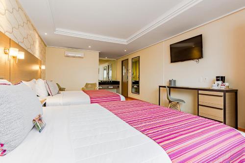 Ein Bett oder Betten in einem Zimmer der Unterkunft KALI Ciudadela Mexico City