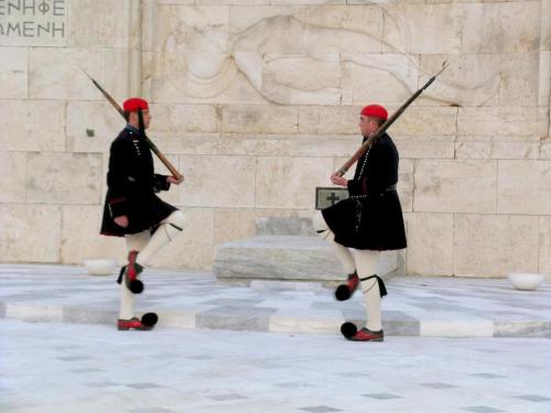 two people in samurai costumes walking in front of a wall at AcroLofts M62 in Athens