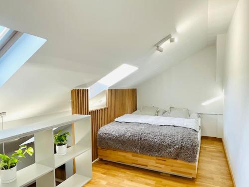 a bedroom with a bed in a attic at Apartament Piccolo in Bielsko-Biała