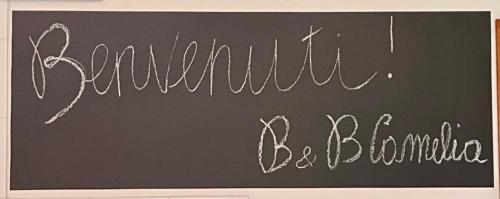 a chalkboard with a sign that says motivation be blonde at B&B Camelia in Città di Castello