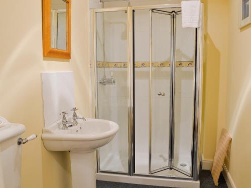 a bathroom with a shower and a sink at Haugh House in Aberlour