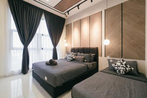 a bedroom with two beds and a window at Arte Mont Kiara 3pax Jacuzzi Pool Gym near MITEC Matrade in Kuala Lumpur