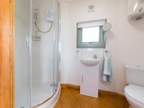 a bathroom with a shower and a sink at Bay in Wootton Bridge