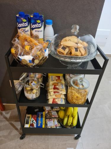 a shelf filled with food and other food items at b&b THE WORLD in Brindisi