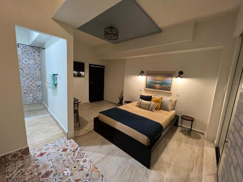 a bedroom with a large bed in a room at 310Guest-House La Vida in San Juan