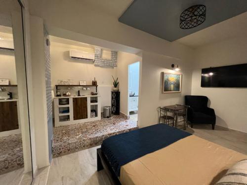 a bedroom with a bed and a living room at 310Guest-House La Vida in San Juan