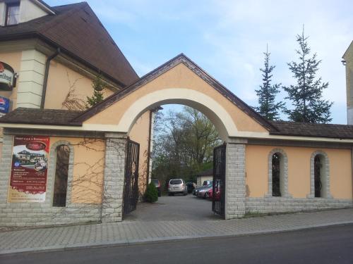 an entrance to a building with an archway at Hotel Bohemia Excellent in Klášterec nad Ohří