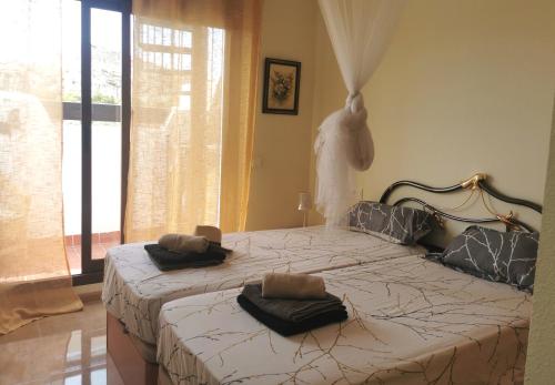 Postel nebo postele na pokoji v ubytování Sol y Alma Mediterranean Apartment