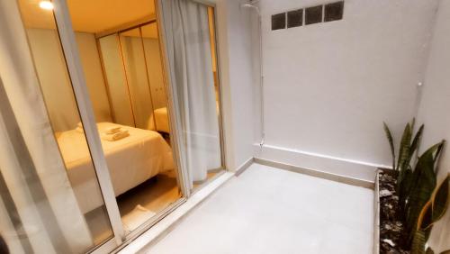 a room with a bed and a mirror at Nb1 apartment free parking con cochera privada in Buenos Aires