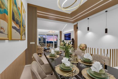 a dining room with a table and chairs at The Goldenhour Apartment in Makarska