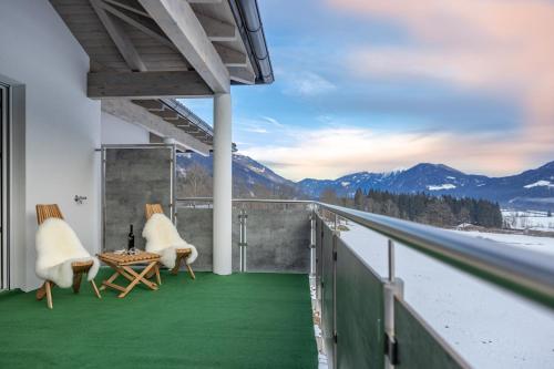 a balcony with green flooring and a view of mountains at Berg Apartment-Berg im Drautal in Berg im Drautal
