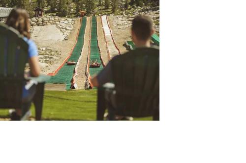 a man in a wheelchair looking at a race track at Ski In/Out - Zalanta - Great Location- 2 Hot Tubs - Heated Pool in South Lake Tahoe