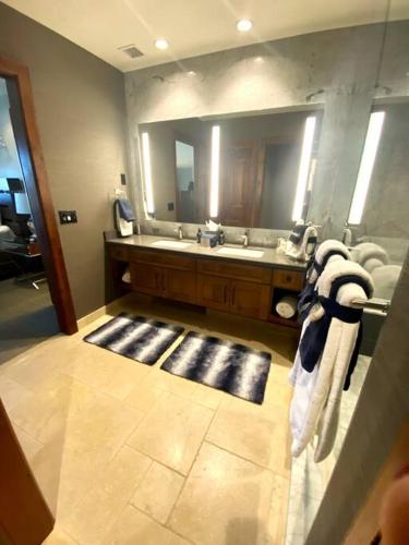 a bathroom with a sink and a large mirror at Ski In/Out - Zalanta - Great Location- 2 Hot Tubs - Heated Pool in South Lake Tahoe
