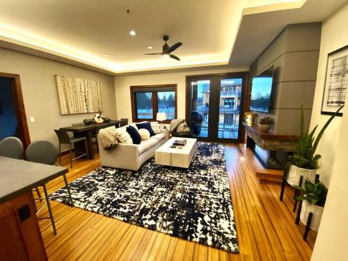 a living room with a couch and a rug at Ski In/Out - Zalanta - Great Location- 2 Hot Tubs - Heated Pool in South Lake Tahoe
