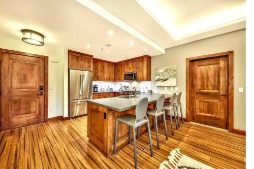 a kitchen with a large table and chairs in it at Ski In/Out - Zalanta - Great Location- 2 Hot Tubs - Heated Pool in South Lake Tahoe