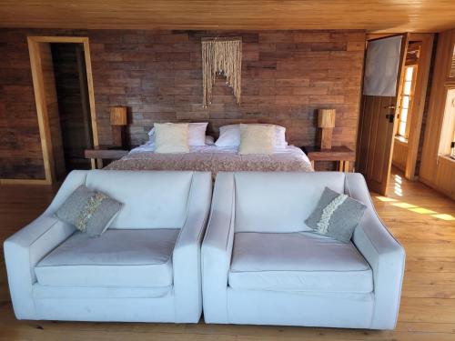 Un pat sau paturi într-o cameră la ALMA CHILOTA