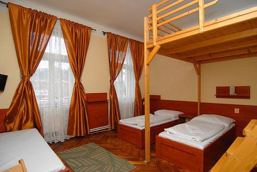 Кровать или кровати в номере Pension Akat