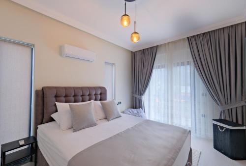 Postel nebo postele na pokoji v ubytování Fethiye Merkezde 6 Kişilik Lüks Villa