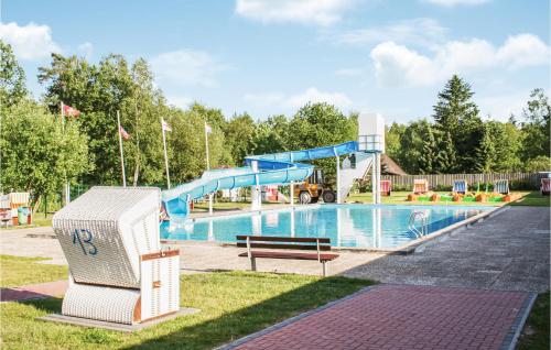 a pool with a slide and a water park at 1 Bedroom Stunning Apartment In Faberg-heidesee in Oberohe