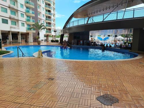 a large swimming pool in the middle of a building at Riviera Park in Caldas Novas