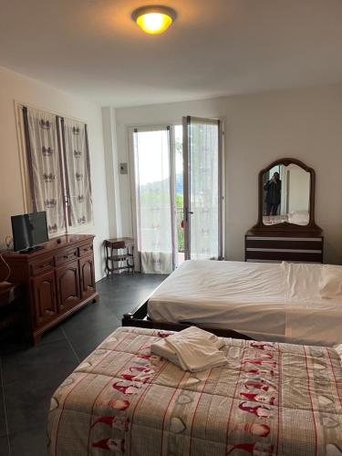 Ένα ή περισσότερα κρεβάτια σε δωμάτιο στο Villaggio Turistico da Tonino