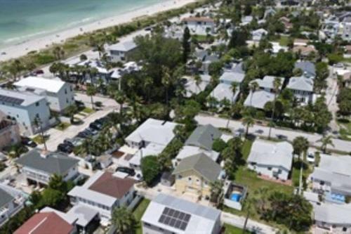 an aerial view of a city with houses and the beach at Seahorse Bungalow in St. Pete Beach