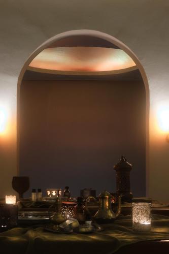 a room with a mirror and a table with candles at Eressian Hotel & Hammam Spa in Eresos