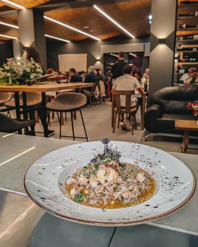 a plate of food on a table in a restaurant at Quinta Dona Iria in Miranda do Corvo