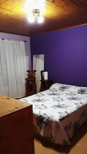 Una cama o camas en una habitación de San Isidro