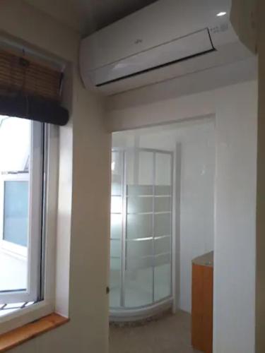 an empty room with a window and a door at Malaga Ensuites City Centre in Málaga