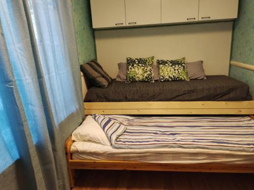 a bedroom with a bunk bed with a bed frame at Veikkola Karstula in Karstula