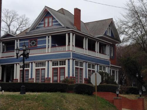 a large blue and white house with a porch at 2439 Fairfield "A Bed and Breakfast" in Shreveport