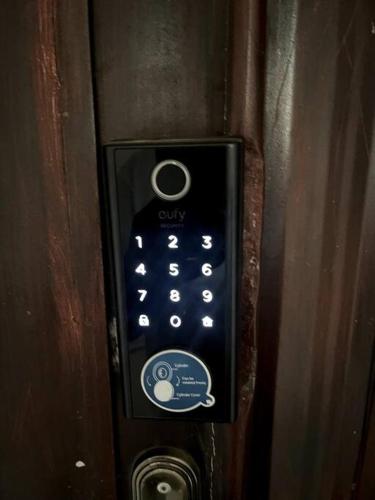 a close up of a remote control on a door at Beautiful 2Br Apt in Ogba, Ikeja, Lagos in Lagos