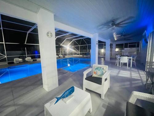 a living room with a pool in the background at Home in Miami in Miami