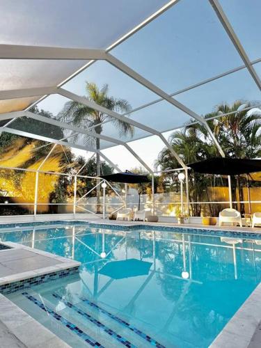 a large swimming pool with a clear blue at Home in Miami in Miami